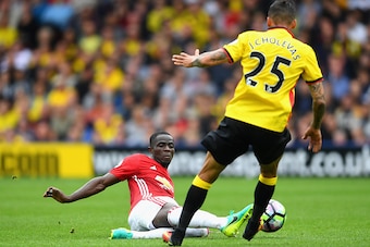 WATFORD, ENGLAND - SEPTEMBER 18: Eric Bailly of Manchester United clears the ball from Jose Holebas of Watford  during the Premier League match between Watford and Manchester United at Vicarage Road on September 18, 2016 in Watford, England.  (Photo by La