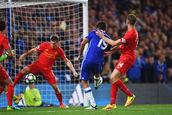 LONDON, ENGLAND - SEPTEMBER 16:  Diego Costa of Chelsea (19) scores their first goal during the Premier League match between Chelsea and Liverpool at Stamford Bridge on September 16, 2016 in London, England.  (Photo by Shaun Botterill/Getty Images)