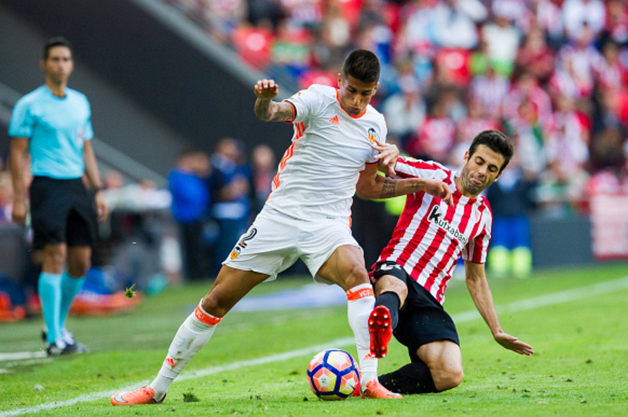 BILBAO, SPAIN - SEPTEMBER 18: Joao Cancelo of Valencia CF competes for the ball with Markel Susaeta of Athletic Club during the La Liga match between Athletic Club Bilbao and Valencia CF at San Mames Stadium on September 18, 2016 in Bilbao, Spain. (Pho BILBAO, SPAIN - SEPTEMBER 18: Joao Cancelo of Valencia CF competes for the ball with Markel Susaeta of Athletic Club during the La Liga match between Athletic Club Bilbao and Valencia CF at San Mames Stadium on September 18, 2016 in Bilbao, Spain. (Pho