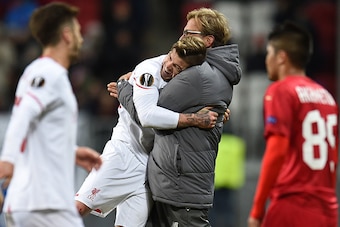 KAZAN, RUSSIA - NOVEMBER 05: Head coach Jurgen Klopp (R) and Alberto Moreno of Liverpool FC celebrate after their victory over FC Rubin Kazan in the UEFA Europa League group B match between FC Rubin Kazan and Liverpool FC at the Kazan Arena Stadium on Nov