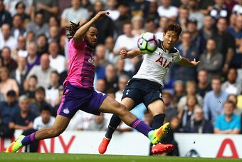 LONDON, ENGLAND - SEPTEMBER 18: Heung-Min Son of Tottenham Hotspur (R) shoots while Jason Denayer of Sunderland (L) attempts a block during the Premier League match between Tottenham Hotspur and Sunderland at White Hart Lane on September 18, 2016 in Londo