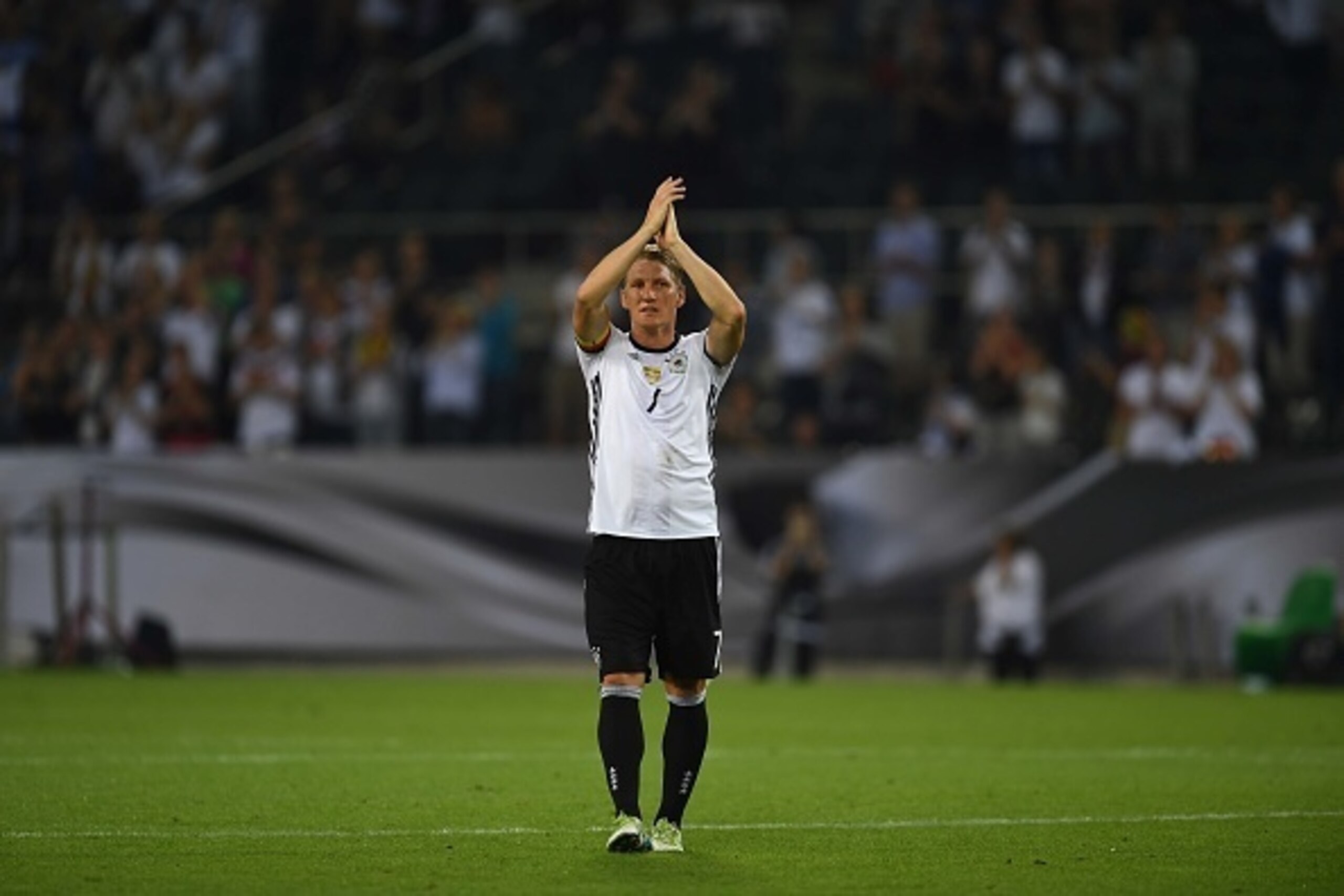 TOPSHOT - Germany's midfielder Bastian Schweinsteiger leaves the pitch during the football friendly match between Germany and Finland, his last game for his country, in Monchengladbach, western Germany on on August 31, 2016.


 / AFP / PATRIK STOLLARZ    
