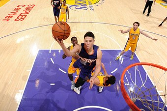 LOS ANGELES, CA - MARCH 18: Devin Booker #1 of the Phoenix Suns goes for the layup during the game against the Los Angeles Lakers on March 18, 2016 at STAPLES Center in Los Angeles, California. NOTE TO USER: User expressly acknowledges and agrees that, by