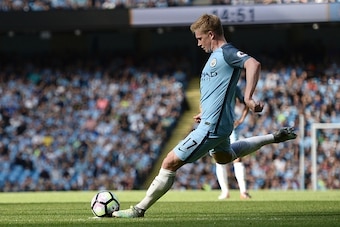 Manchester City's Belgian midfielder Kevin De Bruyne takes a free kick to score the opening goal during the English Premier League football match between Manchester City and Bournemouth at the Etihad Stadium in Manchester, north west England, on September