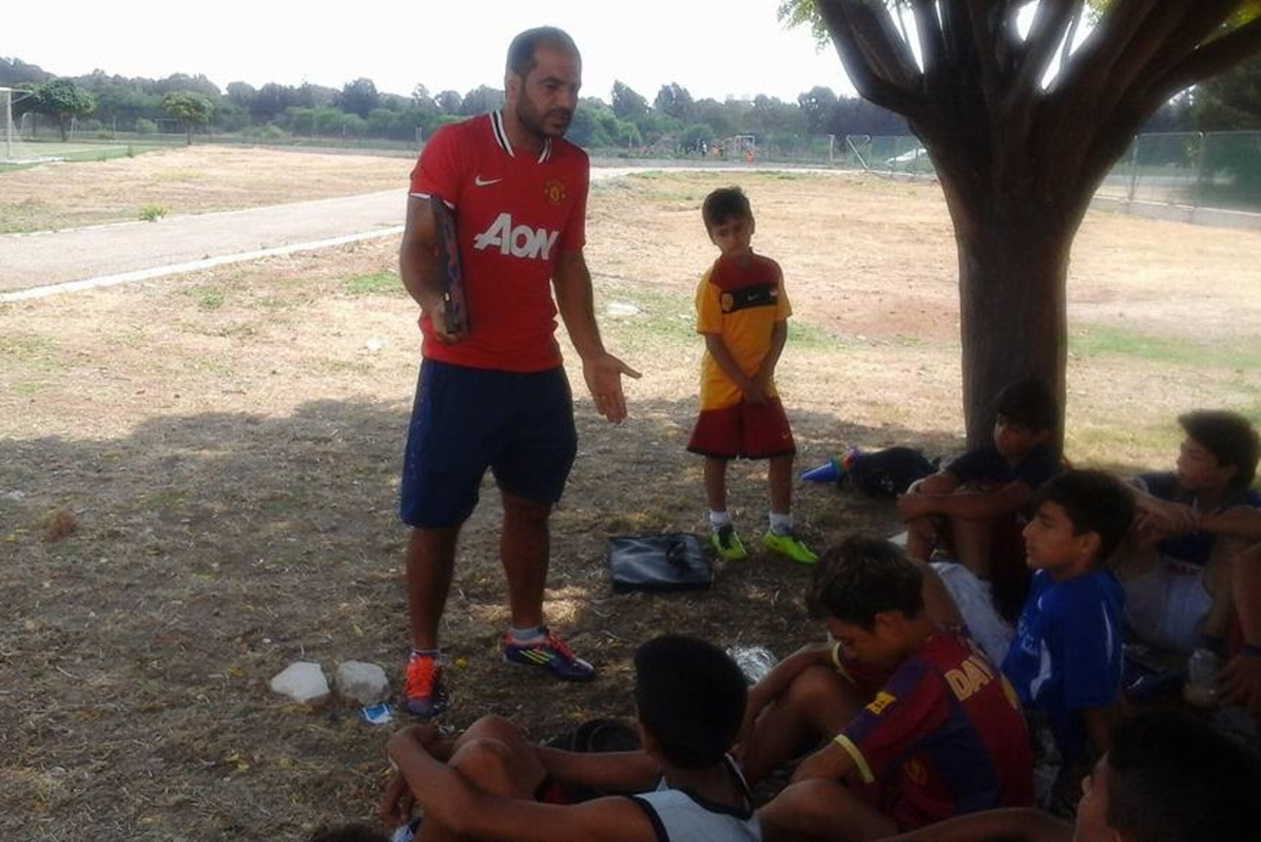 Chabo pictured coaching a group of children