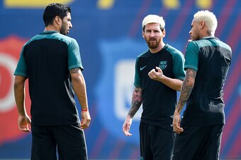 BARCELONA, SPAIN - SEPTEMBER 12:  (L-R) Luis Suarez, Neymar Jr. and Lionel Messi of FC Barcelona talk during a training session ahead of their UEFA Champions League Group C match against Celtic FC at Ciutat Esportiva of Sant Joan Despi on September 12, 20