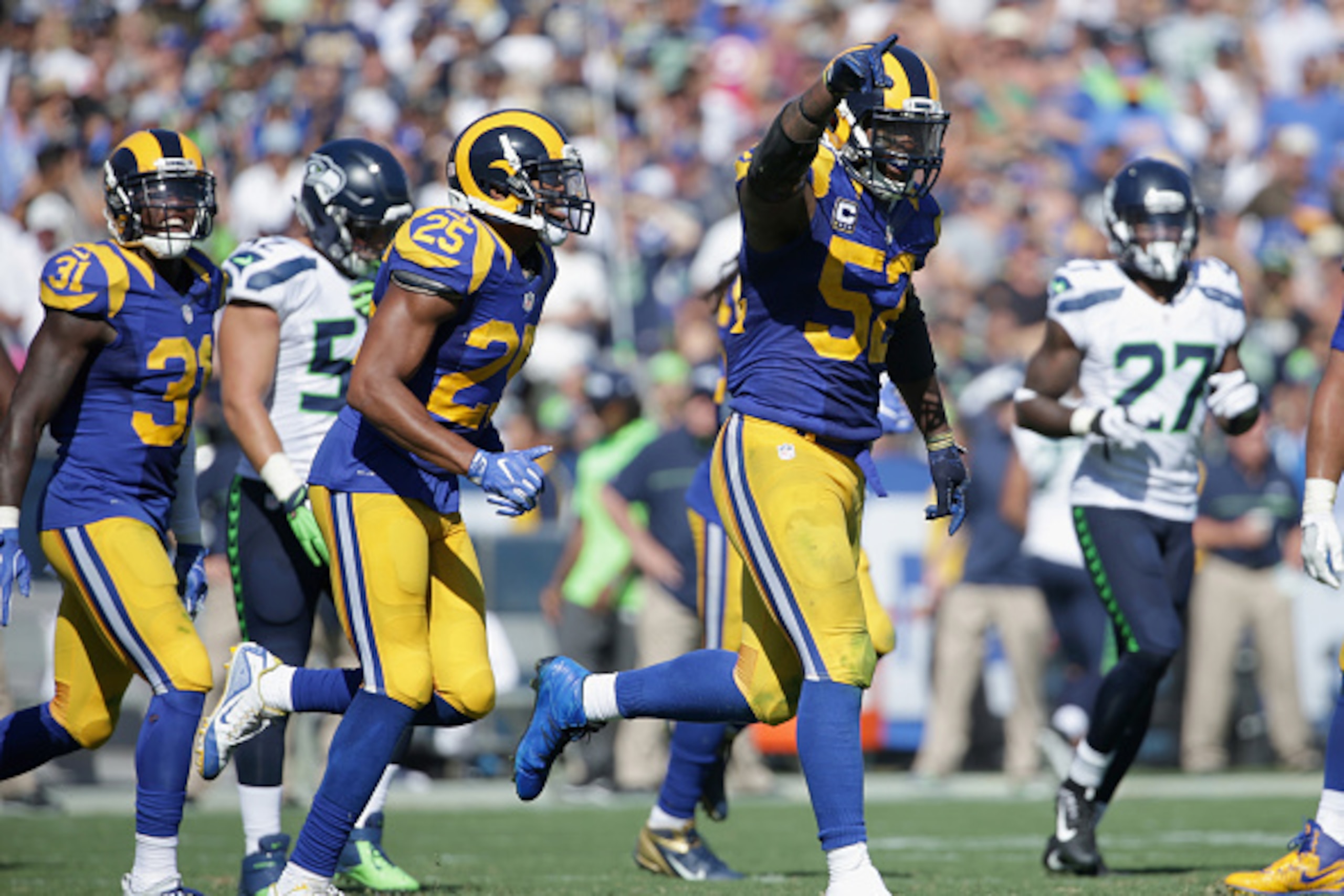 LOS ANGELES, CA - SEPTEMBER 18:  Alec Ogletree #52 of the Los Angeles Rams celebrates during the fourth quarter of the home opening NFL game against the Seattle Seahawks at Los Angeles Coliseum on September 18, 2016 in Los Angeles, California.  (Photo by 