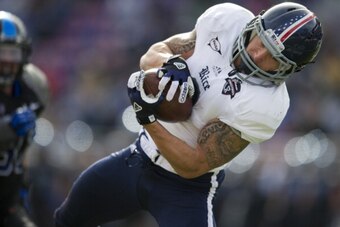 FORT WORTH, TX - DECEMBER 29:  Sam McGuffie #2 of the Rice Owls makes a diving catch against the Air Force Falcons on December 29, 2012 during the Bell Helicopter Armed Forces Bowl at Amon G. Carter Stadium in Fort Worth, Texas.  (Photo by Cooper Neill/Ge