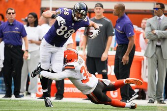CLEVELAND, OH - SEPTEMBER 18: Tight end Dennis Pitta #88 of the Baltimore Ravens is tackled by free safety Derrick Kindred #30 of the Cleveland Browns during the first half at FirstEnergy Stadium on September 18, 2016 in Cleveland, Ohio. (Photo by Jason M