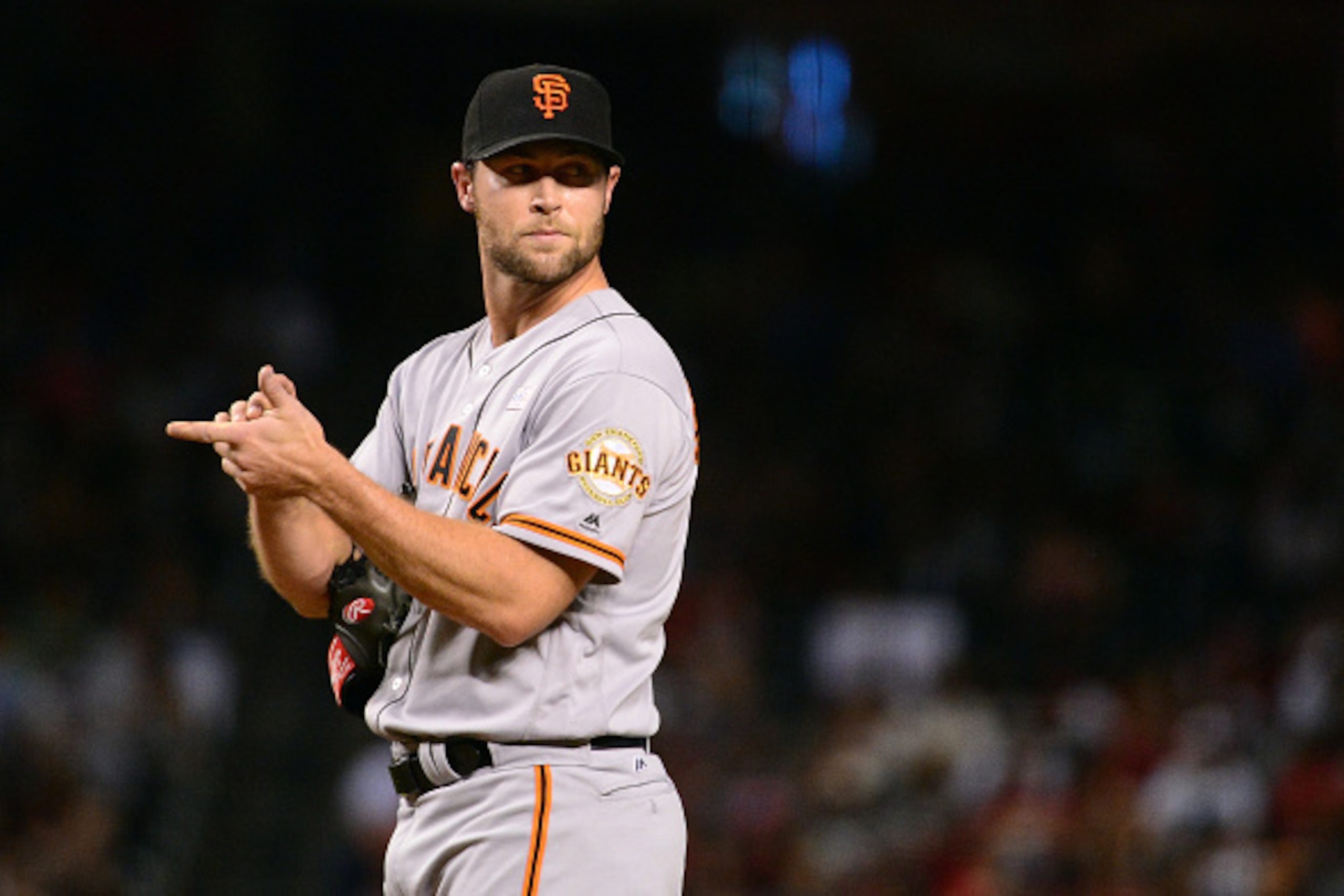 PHOENIX, AZ - MAY 14:  Hunter Strickland #60 of the San Francisco Giants looks over to first base during the eighth inning against the Arizona Diamondbacks at Chase Field on May 14, 2016 in Phoenix, Arizona. The San Francisco Giants won 5-3.  (Photo by Je