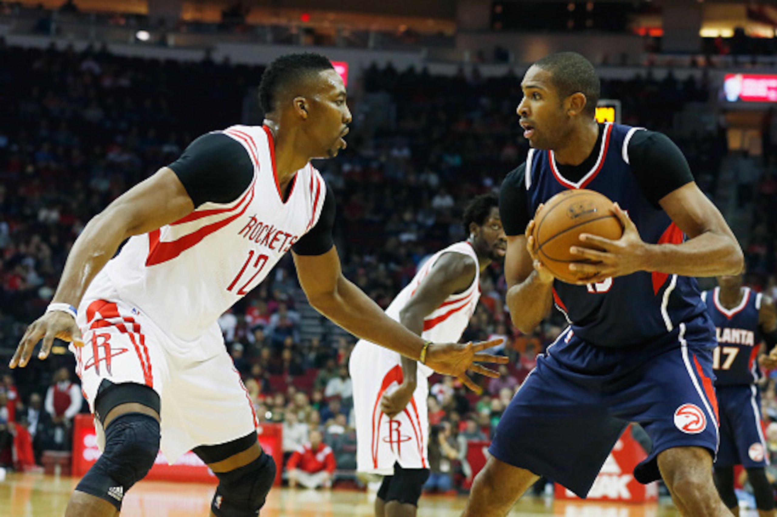 HOUSTON, TX - DECEMBER 20: Dwight Howard #12 of the Houston Rockets defends against Al Horford #15 of the Atlanta Hawks during their game at the Toyota Center on December 20, 2014 in Houston, Texas. (Photo by Scott Halleran/Getty Images) HOUSTON, TX - DECEMBER 20: Dwight Howard #12 of the Houston Rockets defends against Al Horford #15 of the Atlanta Hawks during their game at the Toyota Center on December 20, 2014 in Houston, Texas. (Photo by Scott Halleran/Getty Images)