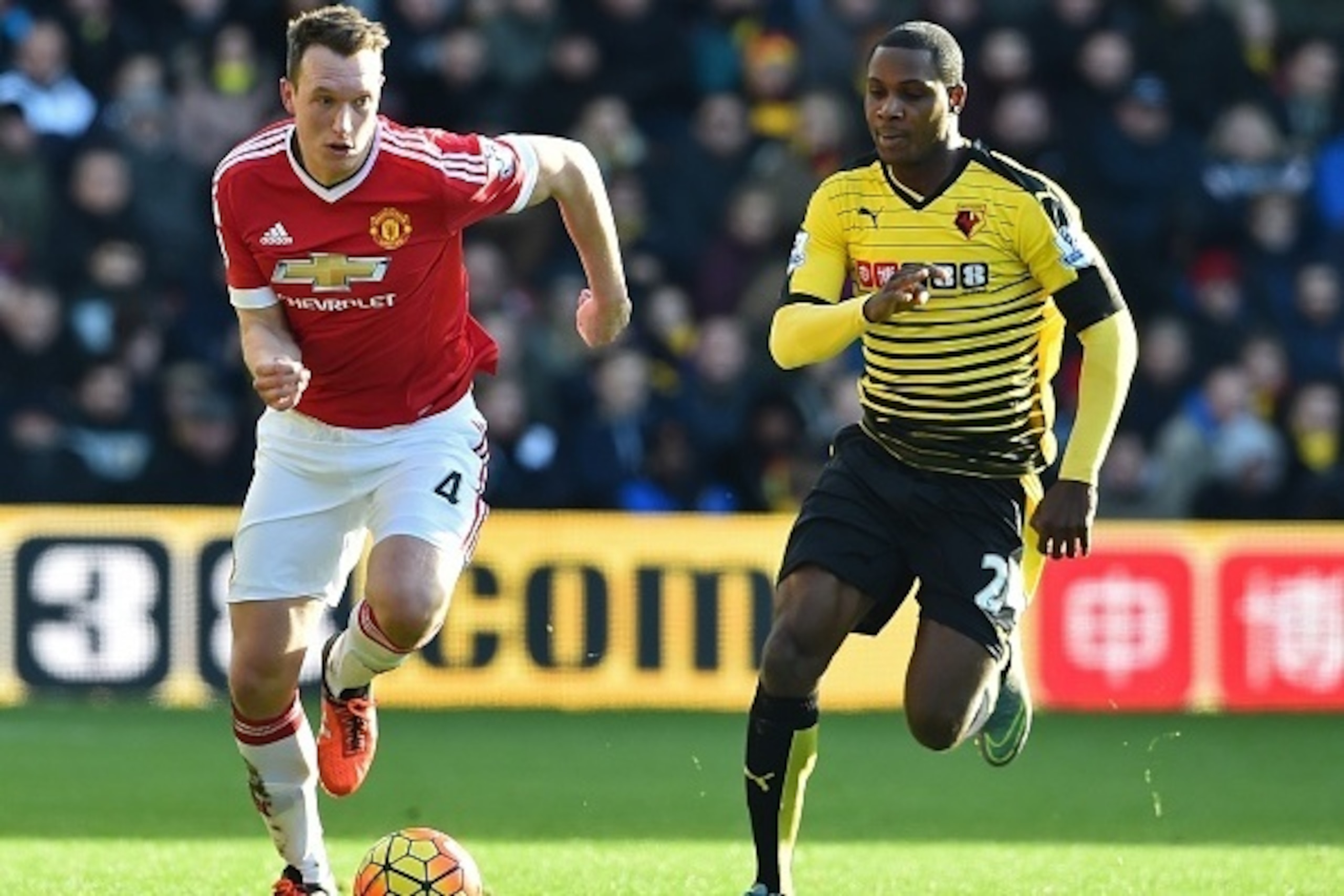 Manchester United's English defender Phil Jones (L) vies with Watford's Nigerian striker Odion Ighalo during the English Premier League football match between Watford and Manchester United at Vicarage Road Stadium in Watford, north of London on November 2