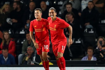 DERBY, ENGLAND - SEPTEMBER 20: Philippe Coutinho (L) of Liverpool celebrates scoring his team's second goal with Roberto Firmino during the EFL Cup Third Round match between Derby County and Liverpool at iPro Stadium on September 20, 2016 in Derby, Englan