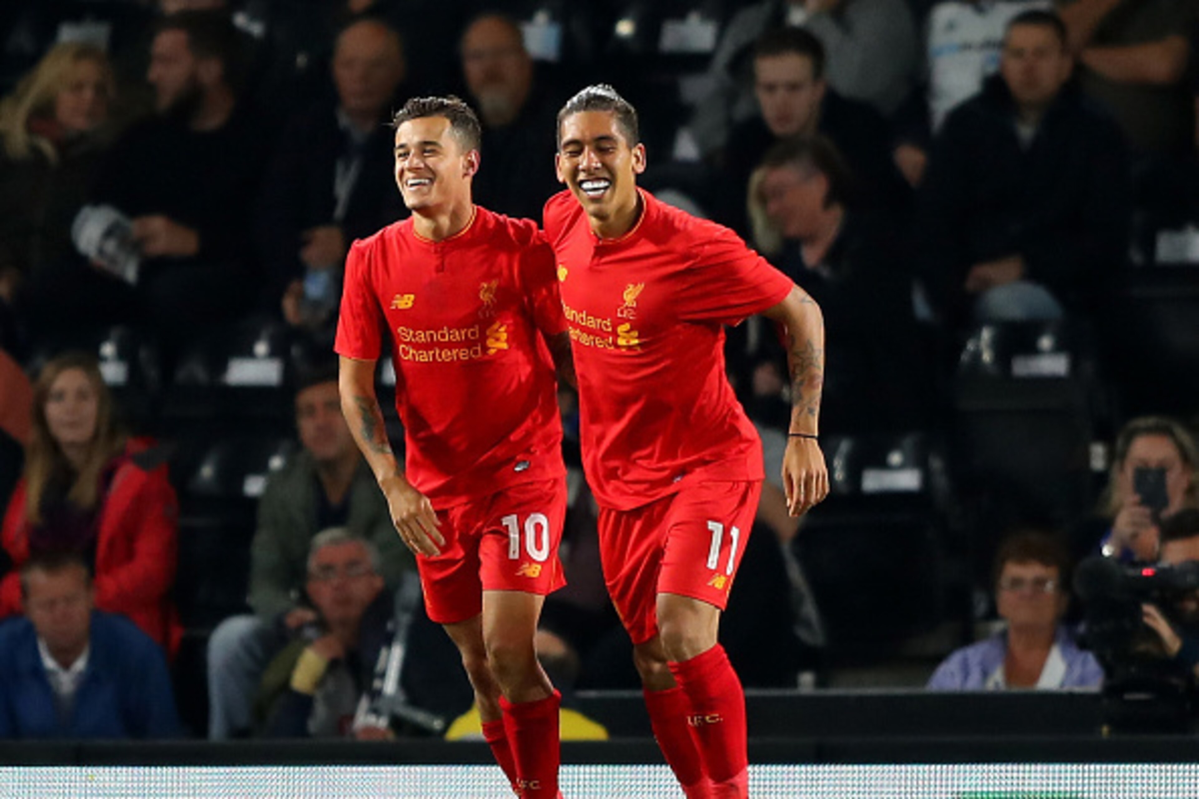 DERBY, ENGLAND - SEPTEMBER 20: Philippe Coutinho (L) of Liverpool celebrates scoring his team's second goal with Roberto Firmino during the EFL Cup Third Round match between Derby County and Liverpool at iPro Stadium on September 20, 2016 in Derby, Englan DERBY, ENGLAND - SEPTEMBER 20: Philippe Coutinho (L) of Liverpool celebrates scoring his team's second goal with Roberto Firmino during the EFL Cup Third Round match between Derby County and Liverpool at iPro Stadium on September 20, 2016 in Derby, Englan