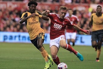 Arsenal's English midfielder Ainsley Maitland-Niles (L) vies with Nottingham Forest's English midfielder Ben Osborn during the English League Cup third round football match between Nottingham Forest and Arsenal at The City Ground in Nottingham, central En