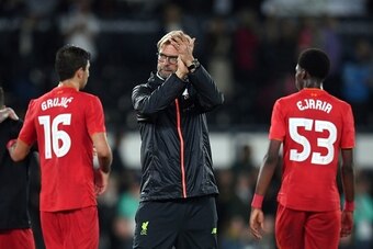 Liverpool's German manager Jurgen Klopp applauds the fans after the final whistle after the English League Cup third-round football match between Derby County and Liverpool at iPro Stadium in Derby, central England on September 20, 2016. Liverpool won the