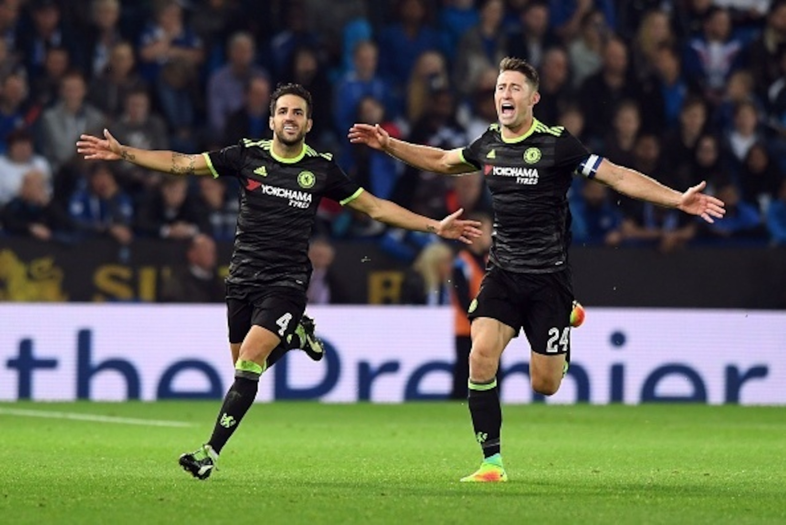 Chelsea's Spanish midfielder Cesc Fabregas (L) celebrates scoring their fourth goal with teammate Gary Cahill (R) during extra-time in the English League Cup third round football match between Leicester City and Chelsea at King Power Stadium in Leicester,