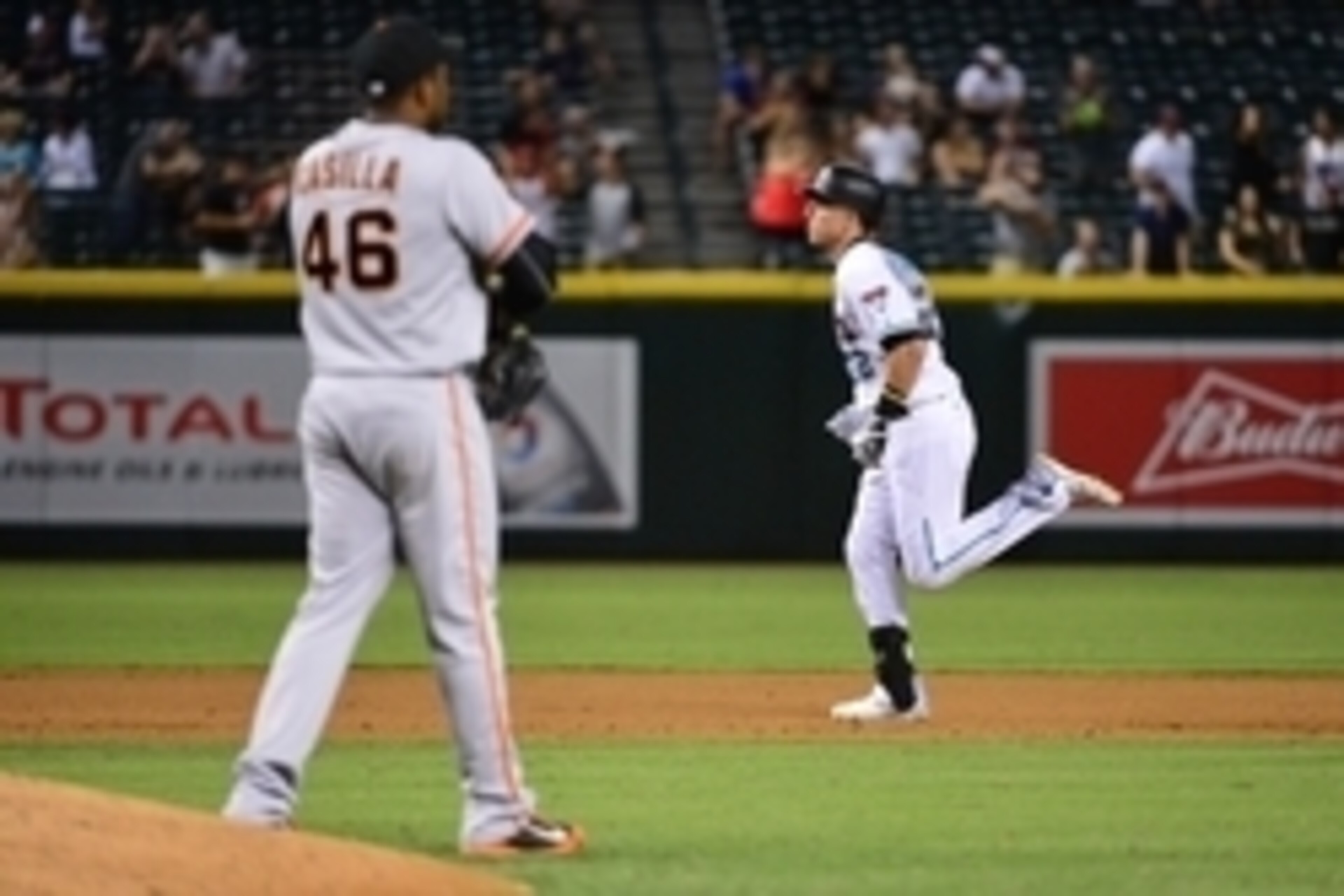 Sep 9, 2016; Phoenix, AZ, USA; Arizona Diamondbacks infielder Jake Lamb (22) hits a solo home run off San Francisco Giants relief pitcher Santiago Casilla (46) during the tenth inning at Chase Field. Mandatory Credit: Jennifer Stewart-USA TODAY Sports