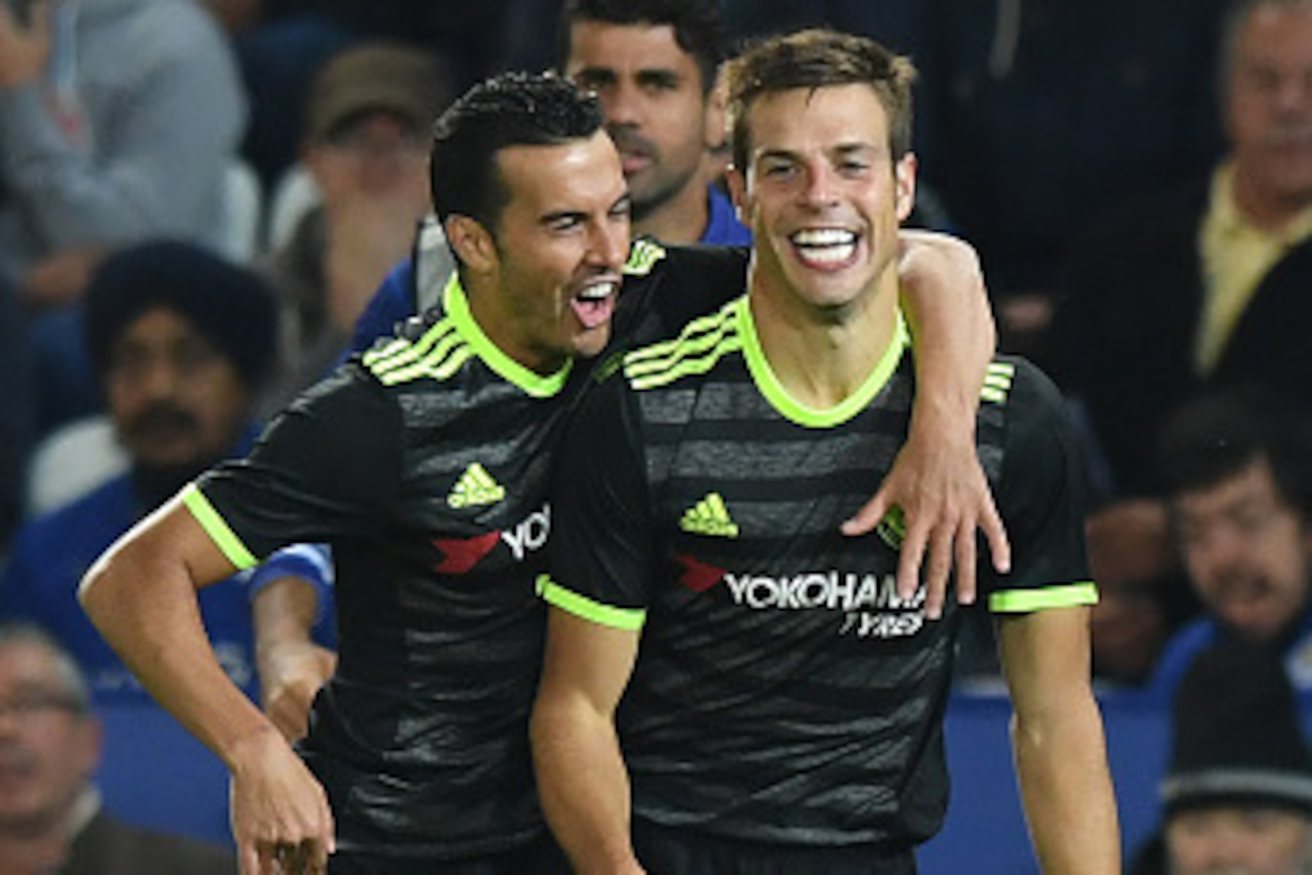 Chelsea's Spanish defender Cesar Azpilicueta (R) celebrates with Chelsea's Spanish midfielder Pedro after scoring their second goal during the English League Cup third round football match between Leicester City and Chelsea at King Power Stadium in Leices