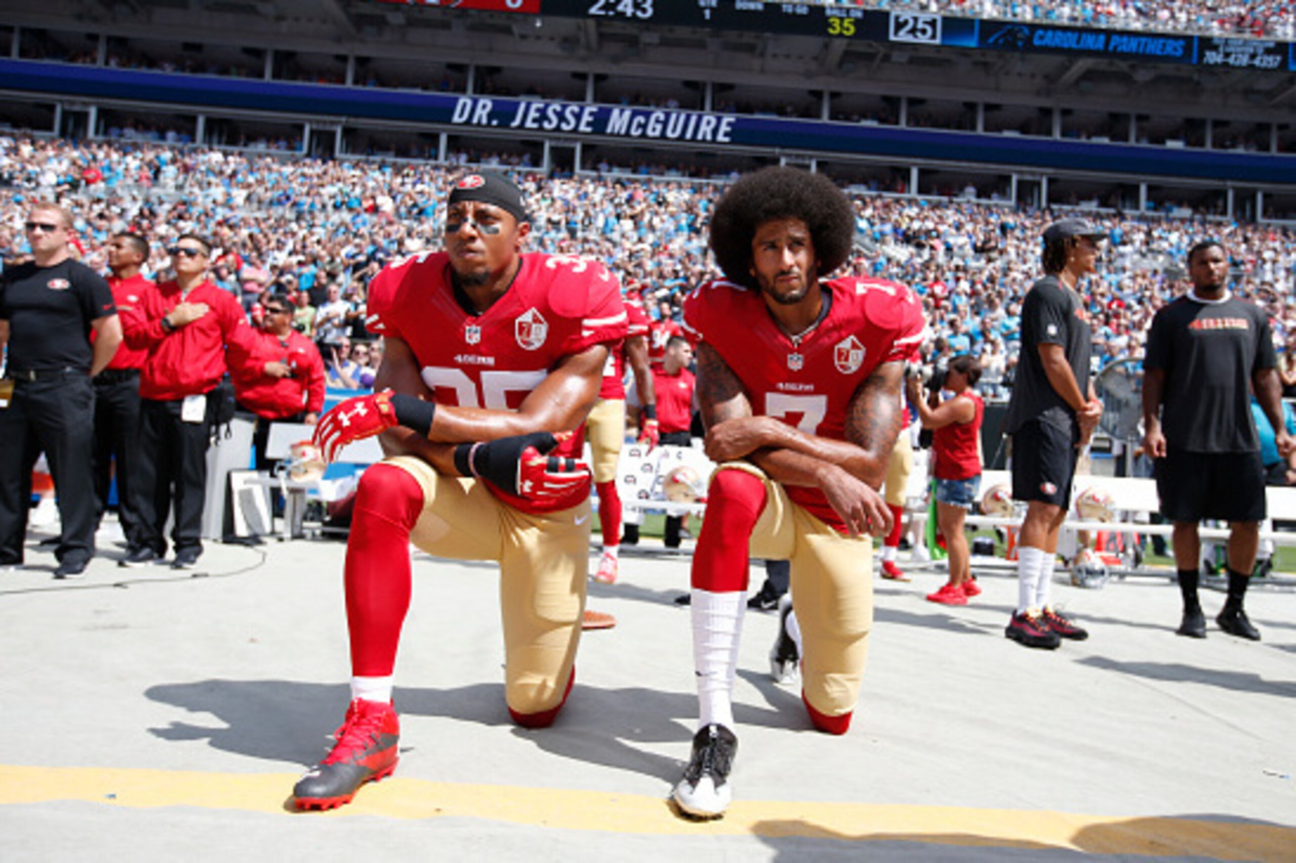 CHARLOTTE, NC - SEPTEMBER 18: Eric Reid #35 and Colin Kaepernick #7 of the San Francisco 49ers kneel on the sideline, during the anthem, prior to the game against the Carolina Panthers at Bank of America Stadium on September 18, 2016 in Charlotte, North C