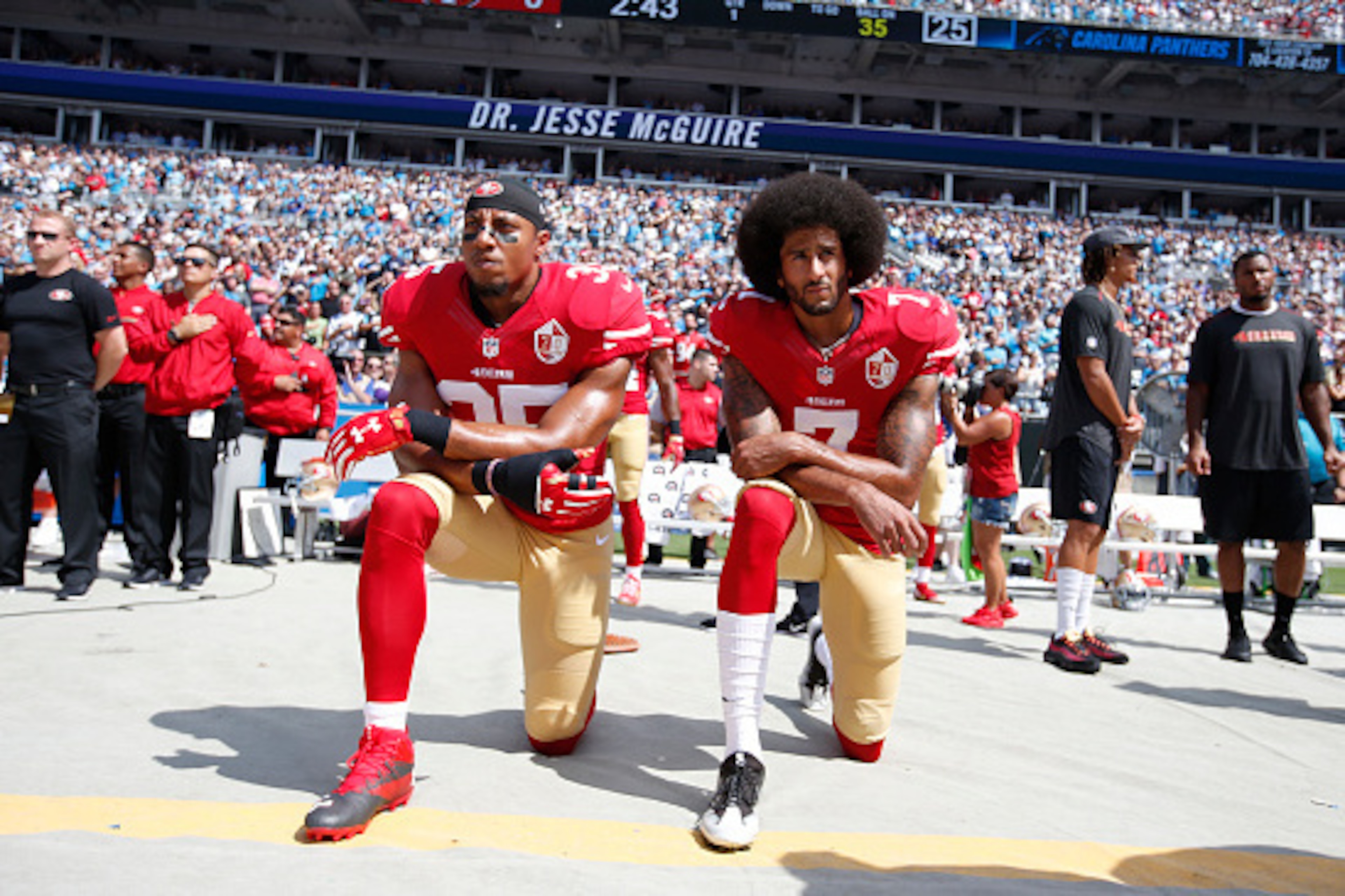 CHARLOTTE, NC - SEPTEMBER 18: Eric Reid #35 and Colin Kaepernick #7 of the San Francisco 49ers kneel on the sideline, during the anthem, prior to the game against the Carolina Panthers at Bank of America Stadium on September 18, 2016 in Charlotte, North C