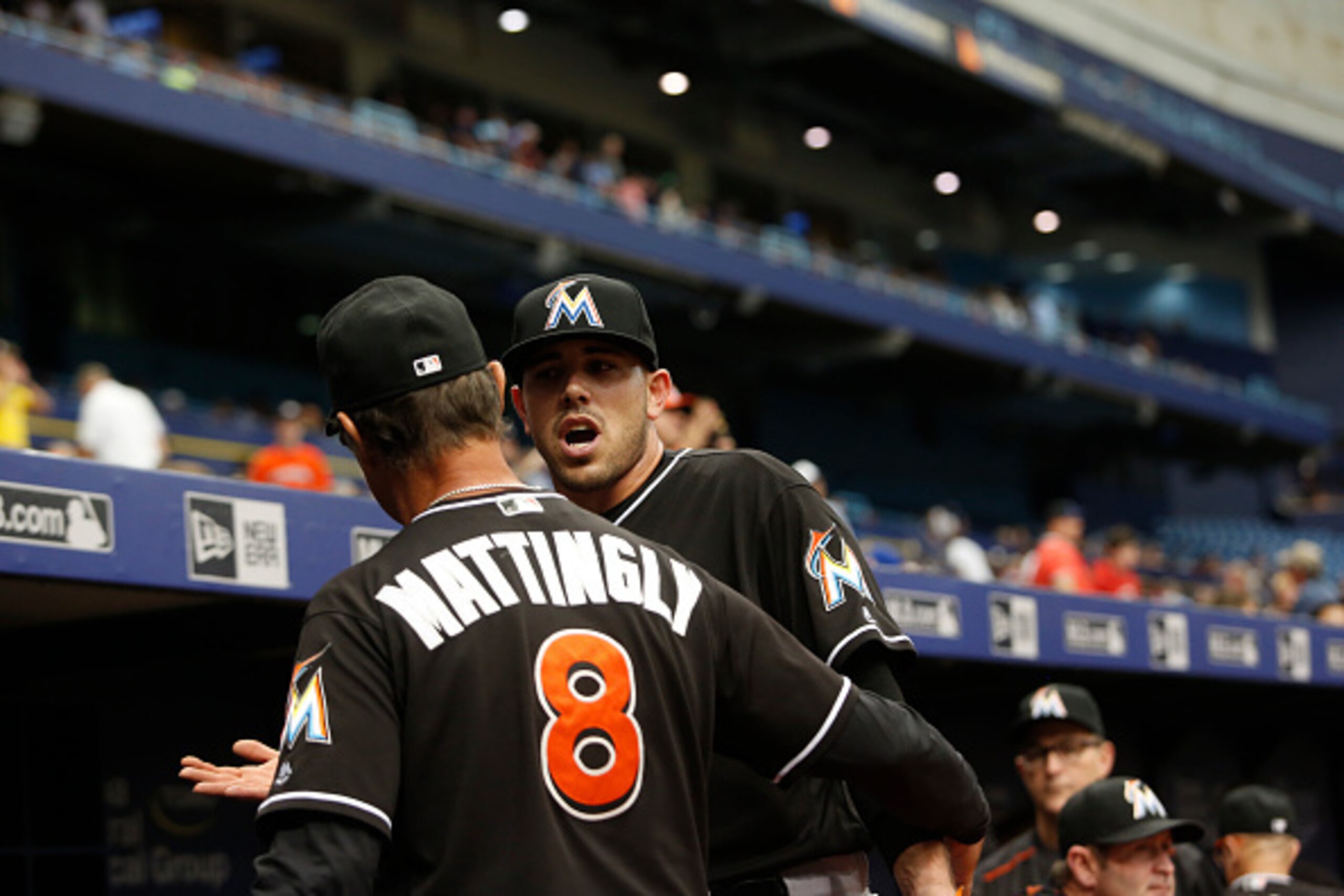 ST. PETERSBURG, FL - MAY 26:  Manager Don Mattingly #8 of the Miami Marlins guides pitcher Jose Fernandez #16 into the dugout after coming out to separate Fernandez from a verbal confrontation on the field with Curt Casali of the Tampa Bay Rays at the end