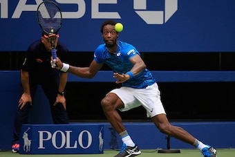 NEW YORK, NY - SEPTEMBER 09:  Gael Monfils of France returns a shot against Novak Djokovic of Serbia during their Men's Singles Semifinal Match on Day Twelve of the 2016 US Open at the USTA Billie Jean King National Tennis Center on September 9, 2016 in t