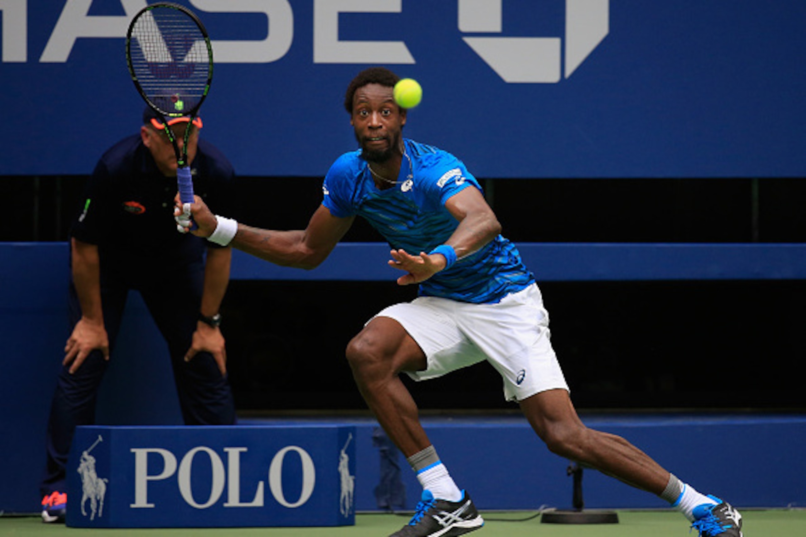 NEW YORK, NY - SEPTEMBER 09:  Gael Monfils of France returns a shot against Novak Djokovic of Serbia during their Men's Singles Semifinal Match on Day Twelve of the 2016 US Open at the USTA Billie Jean King National Tennis Center on September 9, 2016 in t
