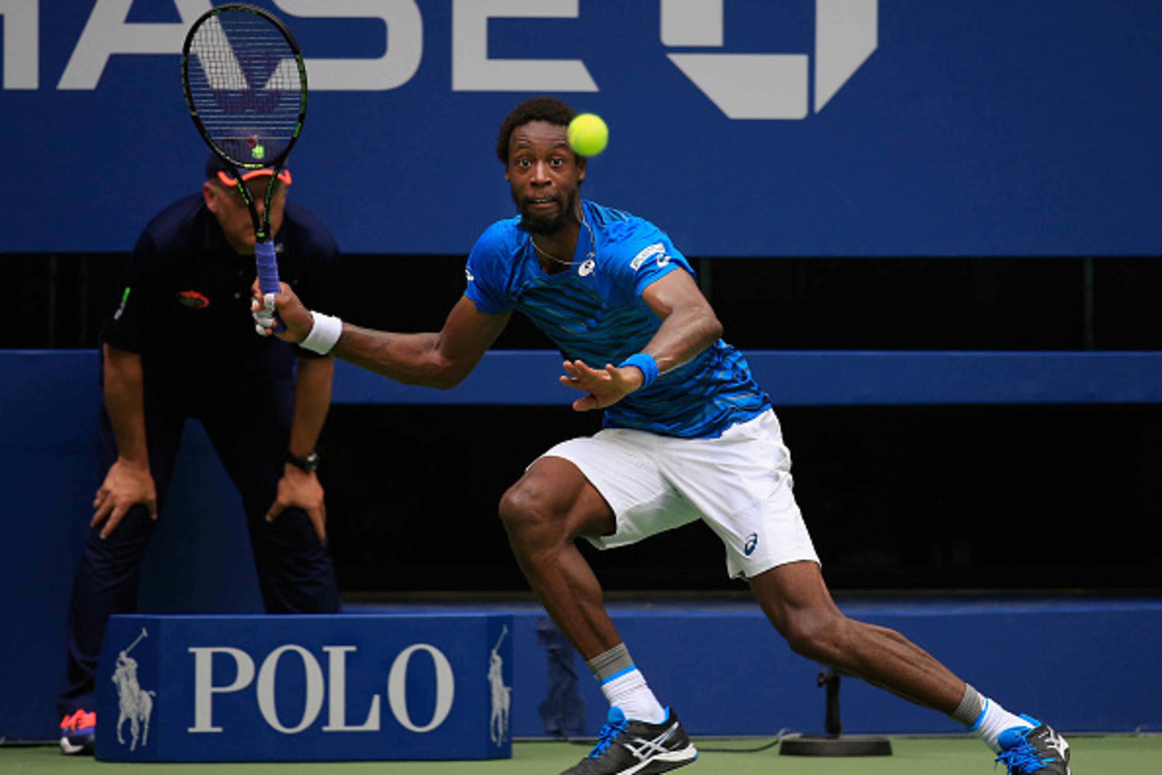 NEW YORK, NY - SEPTEMBER 09: Gael Monfils of France returns a shot against Novak Djokovic of Serbia during their Men's Singles Semifinal Match on Day Twelve of the 2016 US Open at the USTA Billie Jean King National Tennis Center on September 9, 2016 in t NEW YORK, NY - SEPTEMBER 09: Gael Monfils of France returns a shot against Novak Djokovic of Serbia during their Men's Singles Semifinal Match on Day Twelve of the 2016 US Open at the USTA Billie Jean King National Tennis Center on September 9, 2016 in t