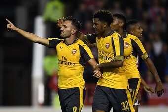 NOTTINGHAM, ENGLAND - SEPTEMBER 20:  Lucas Perez (L) of Arsenal celebrates scoring his team's third goal with Chuba Akpom of Arsenal during the EFL Cup Third Round match between Nottingham Forest and Arsenal at City Ground on September 20, 2016 in Notting