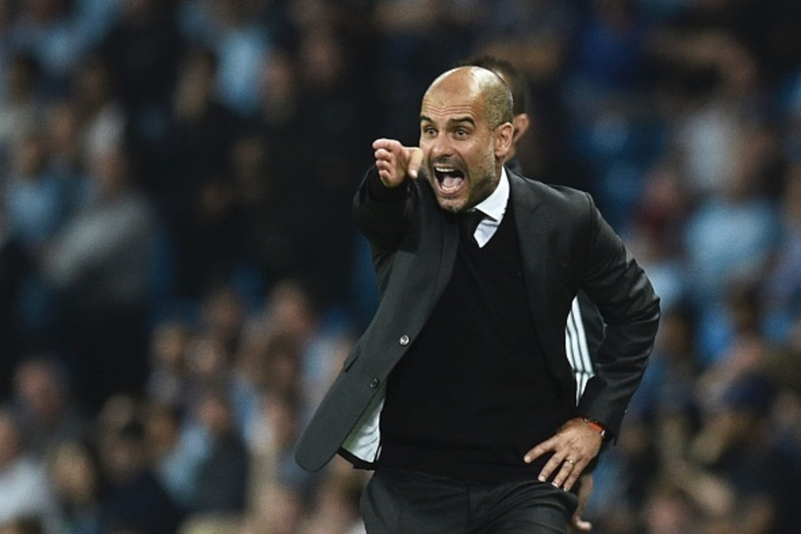Manchester City's Spanish manager Pep Guardiola gesutres on the touchline during the UEFA Champions League group C football match between Manchester City and Borussia Monchengladbach at the Etihad stadium in Manchester, northwest England, on September 14,