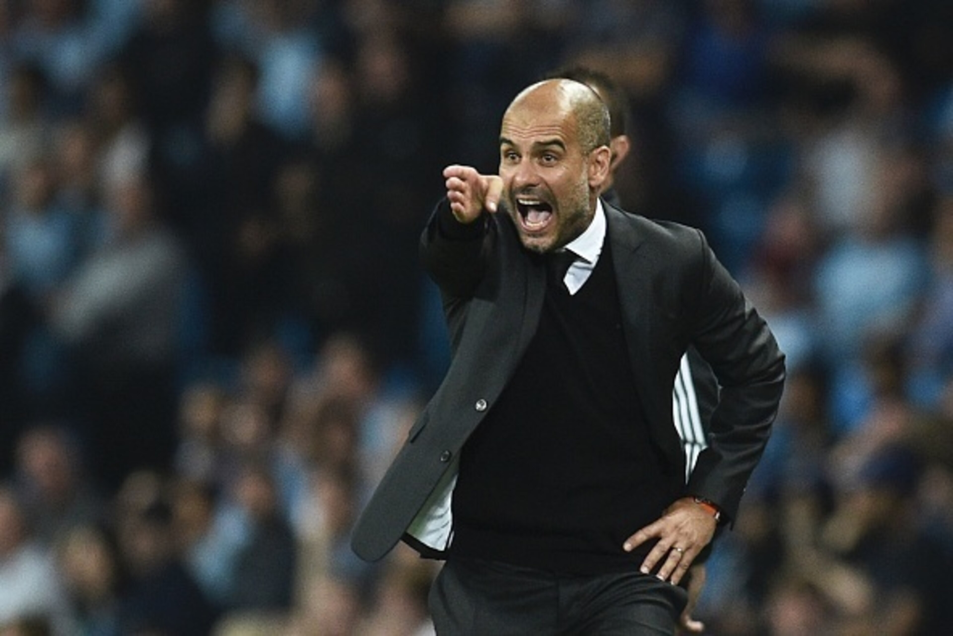 Manchester City's Spanish manager Pep Guardiola gesutres on the touchline during the UEFA Champions League group C football match between Manchester City and Borussia Monchengladbach at the Etihad stadium in Manchester, northwest England, on September 14,