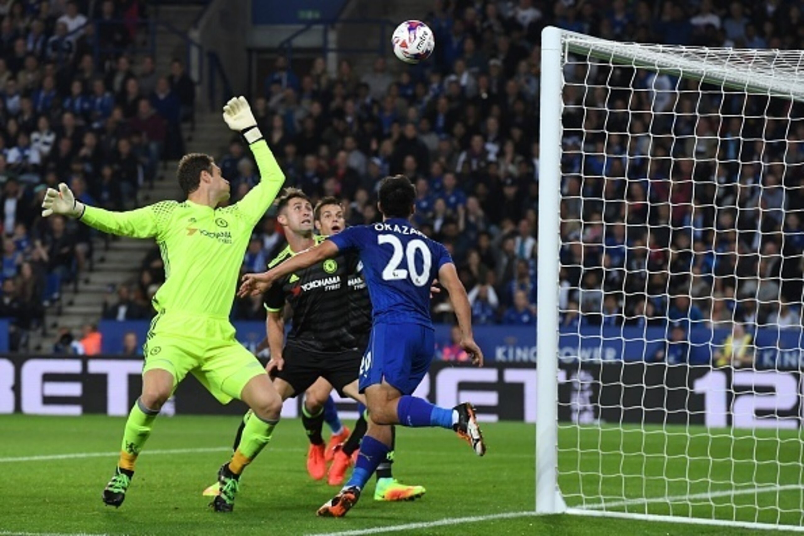 Leicester City's Japanese striker Shinji Okazaki (R) places a header past Chelsea's Bosnian goalkeeper Asmir Begovic (L), Chelsea's English defender Gary Cahill (2nd L) and Chelsea's Spanish defender Cesar Azpilicueta to score the opening goal of the Engl