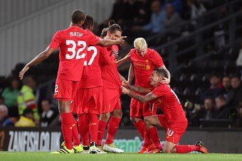 DERBY, ENGLAND - SEPTEMBER 20: Philippe Coutinho of Liverpool celebrates with his team mates after scoring a goal to make it 0-2 during the EFL Cup Third Round match between Derby County and Liverpool at iPro Stadium on September 20, 2016 in Derby, Englan