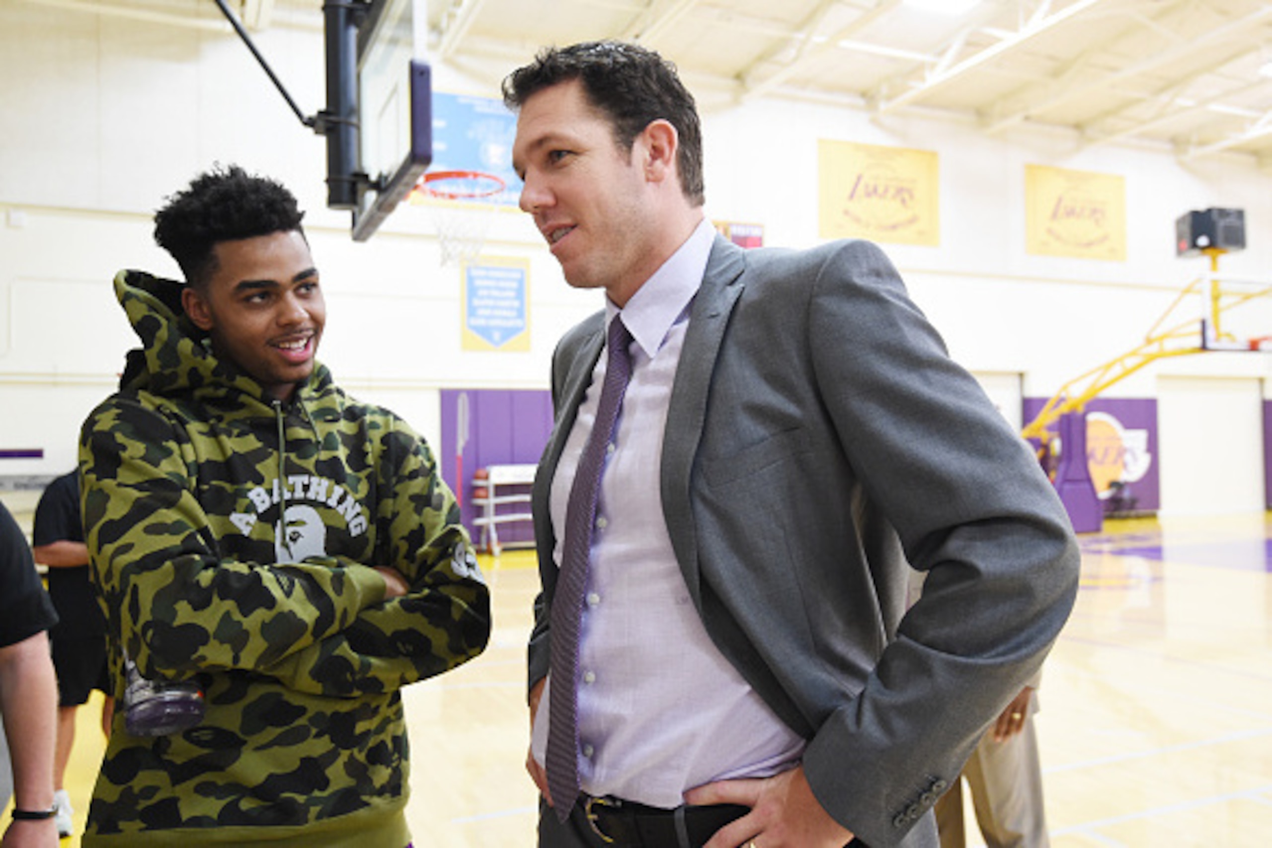 EL SEGUNDO, CA - JUNE 21: D'Angelo Russell #1 of the Los Angeles Lakers speaks with Luke Walton after being introduced as head coach of the Los Angeles Lakers on June 21, 2016 at Toyota Sports Center in El Segundo, California. NOTE TO USER: User expressly