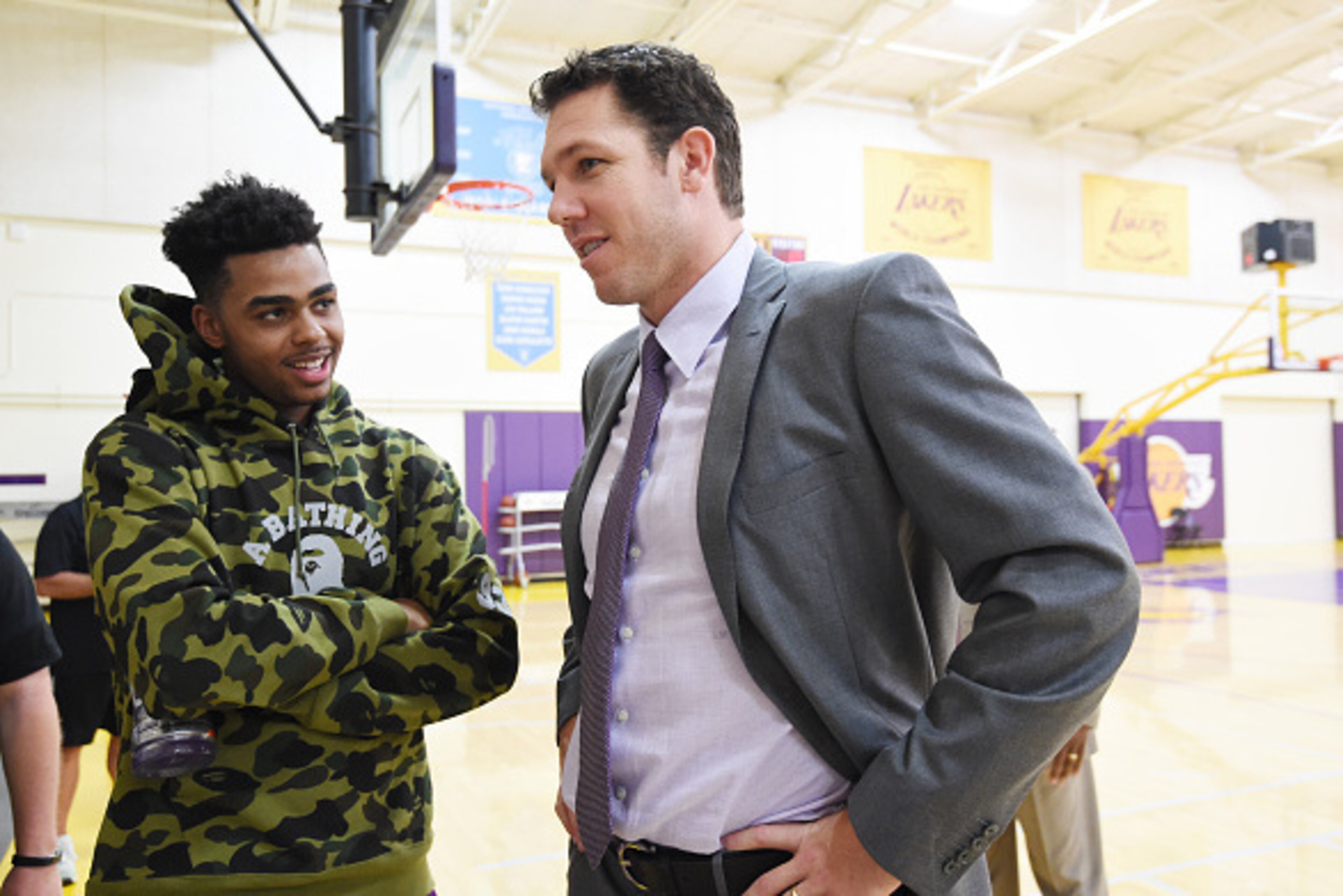 EL SEGUNDO, CA - JUNE 21: D'Angelo Russell #1 of the Los Angeles Lakers speaks with Luke Walton after being introduced as head coach of the Los Angeles Lakers on June 21, 2016 at Toyota Sports Center in El Segundo, California. NOTE TO USER: User expressly