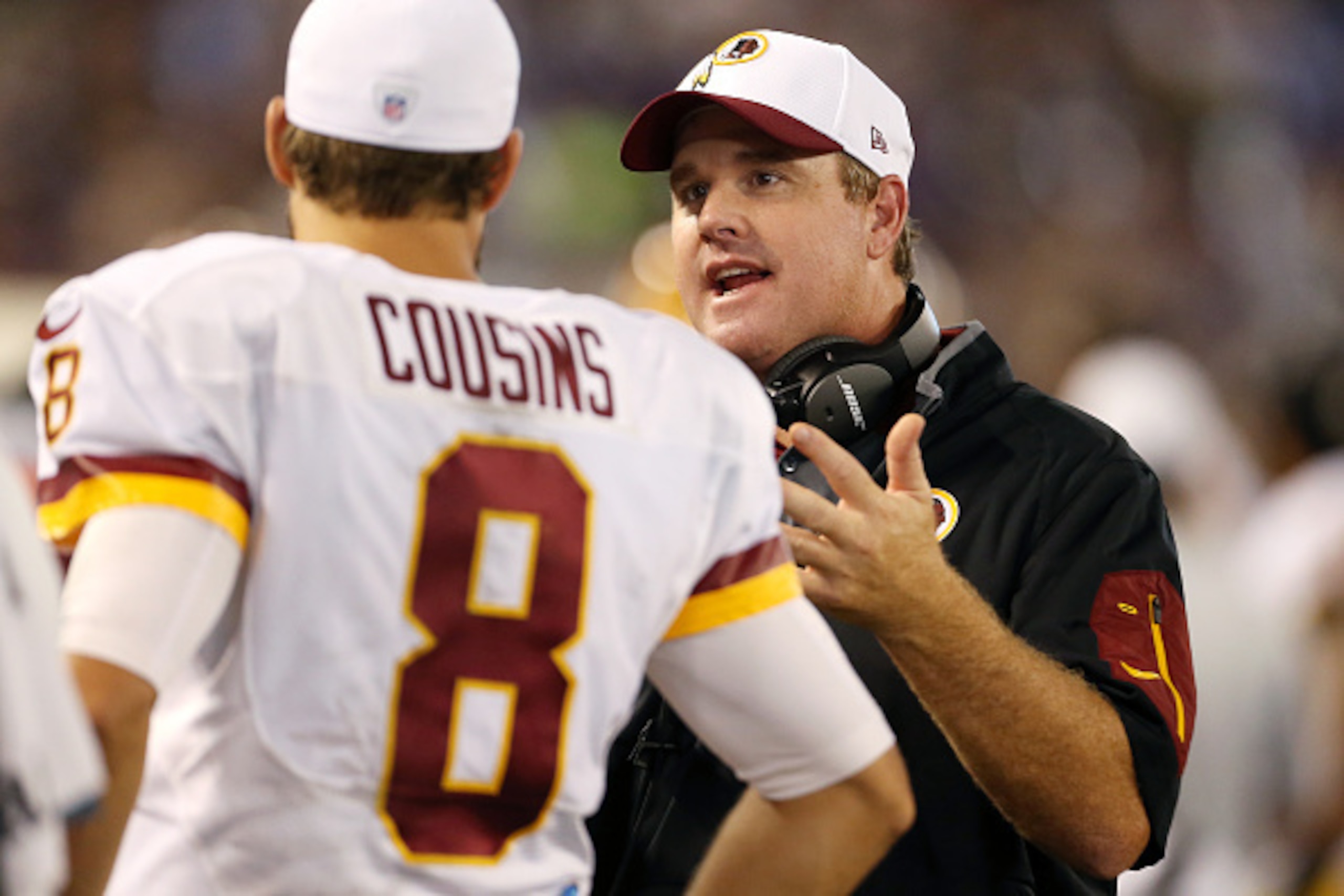 BALTIMORE, MD - AUGUST 29: Head coach Jay Gruden of the Washington Redskins talks with quarterback Kirk Cousins #8 of the Washington Redskins in the fourth quarter of a preseason game against the Baltimore Ravens at M&T Bank Stadium on August 29, 2015 in 