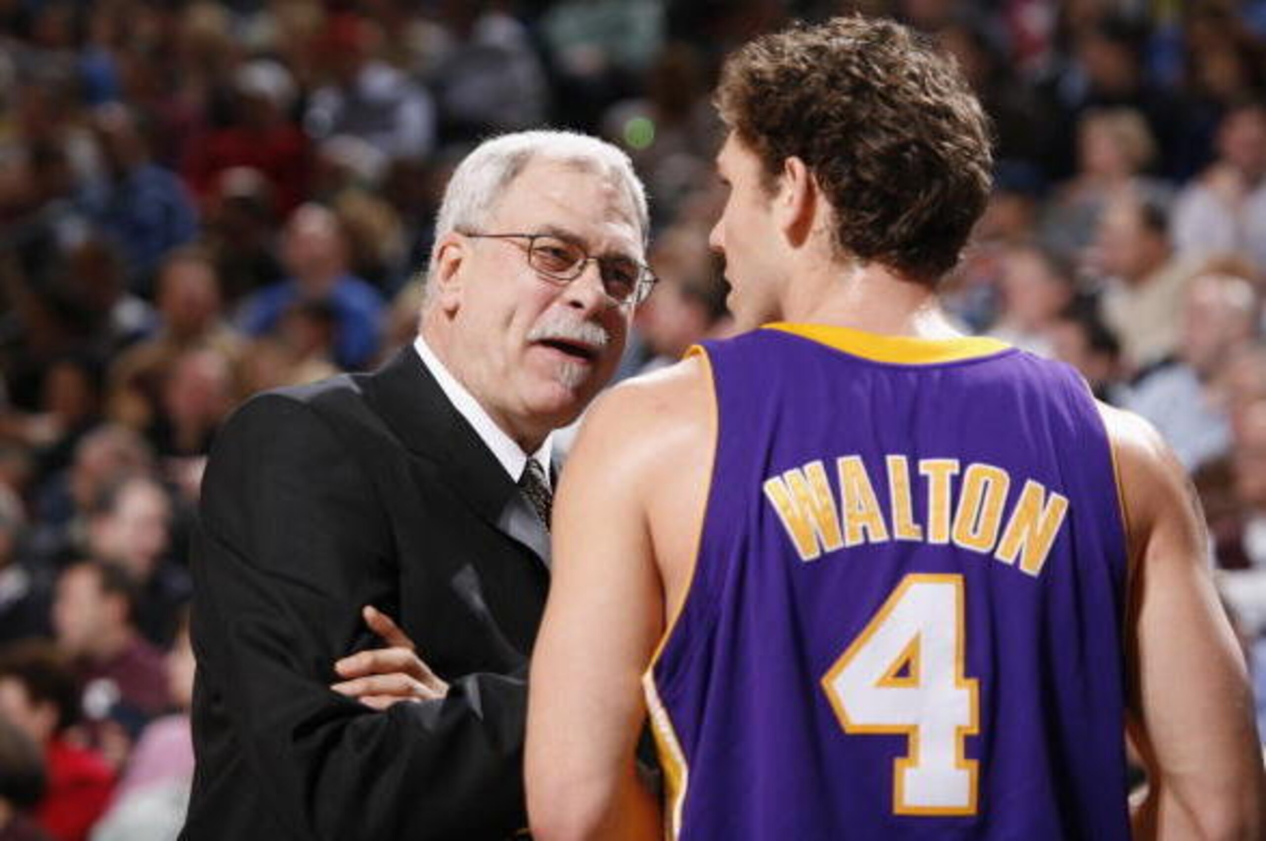 DALLAS - FEBRUARY 7:  Head coach Phil Jackson of the Los Angeles Lakers talks ot his teammate Luke Walton #4 during the game against the Dallas Mavericks at American Airlines Arena on February 7, 2006 in Dallas, Texas.  The Mavericks won 102-87.  NOTE TO 