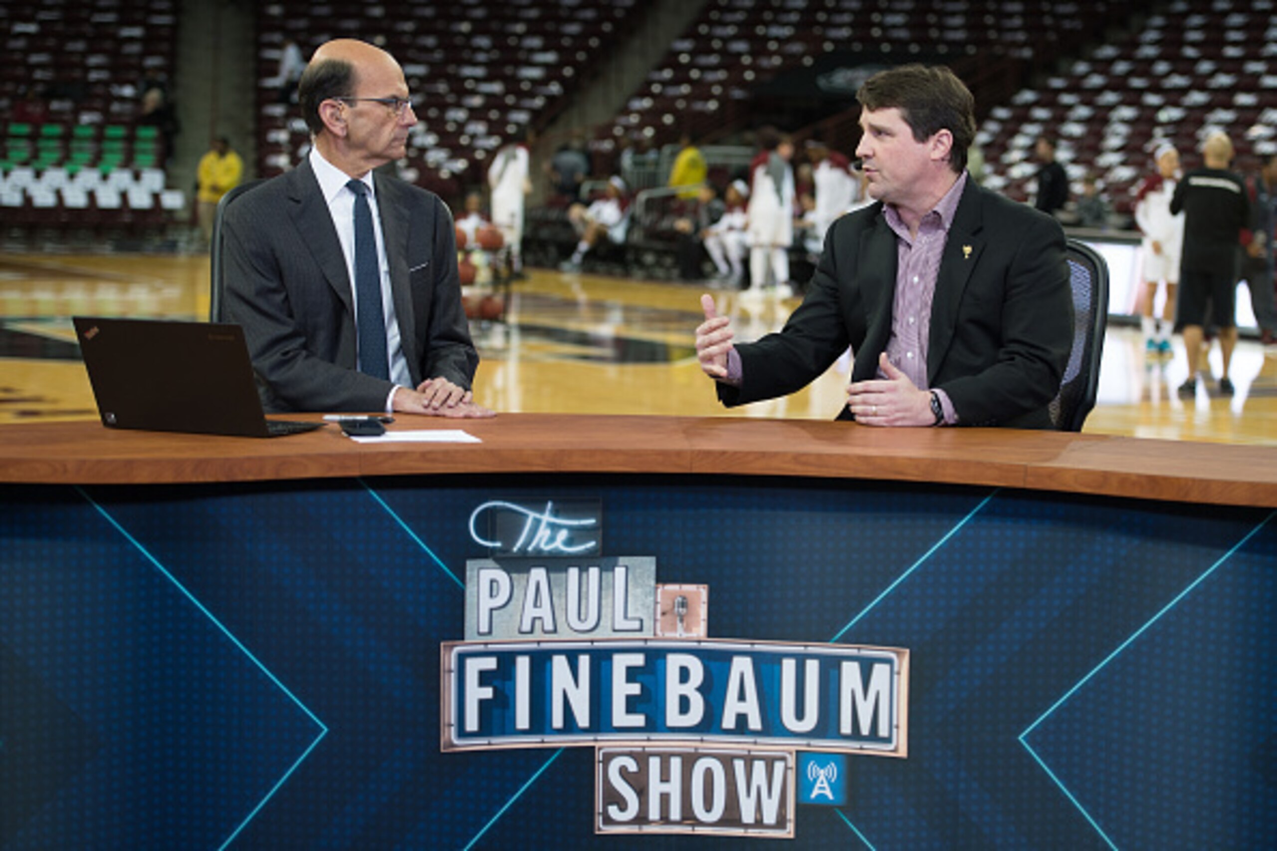 COLUMBIA, SC - FEBRUARY 08: South Carolina football head coach Will Muschamp (R) speaks with radio personality Paul Finebaum prior to the game between the Connecticut Huskies and the South Carolina Gamecocks at Colonial Life Arena on February 8, 2016 in C