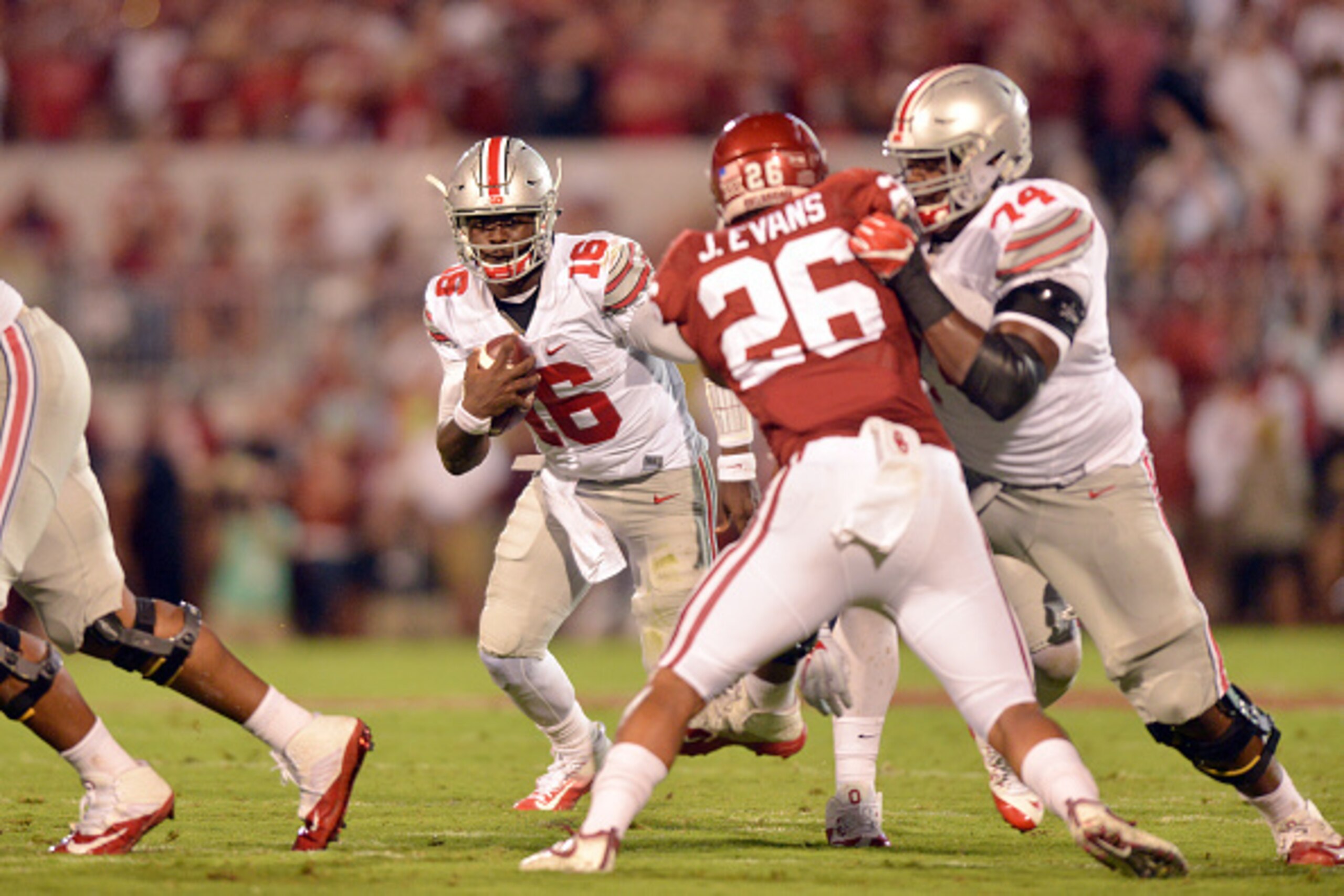 NORMAN, OK - SEPTEMBER 17: Quarterback J.T. Barrett #16 of the Ohio State Buckeyes looks for running room during the first half of their game against the Oklahoma Sooners on September 17, 2016 at Gaylord Family Oklahoma Memorial Stadium in Norman, Oklahom