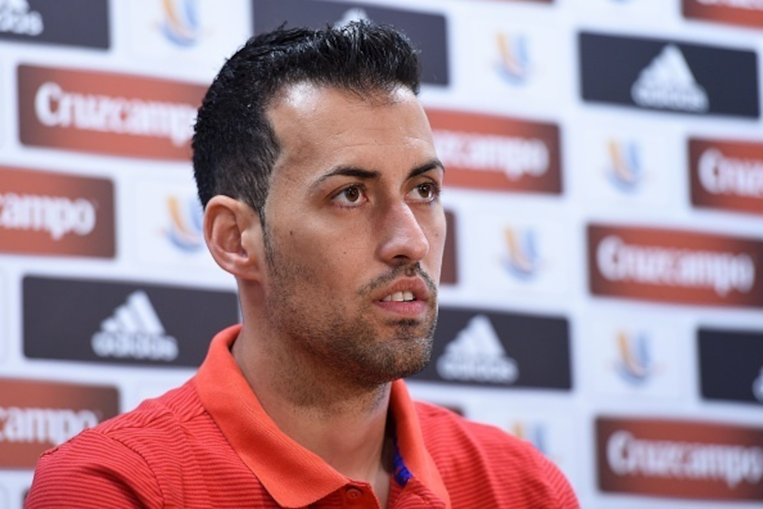 Barcelona's midfielder Sergio Busquets looks on during a press conference following a training session at the Sports Center FC Barcelona Joan Gamper in Sant Joan Despi, near to Barcelona on August 13, 2016, on the eve of the first leg of the Spanish Super
