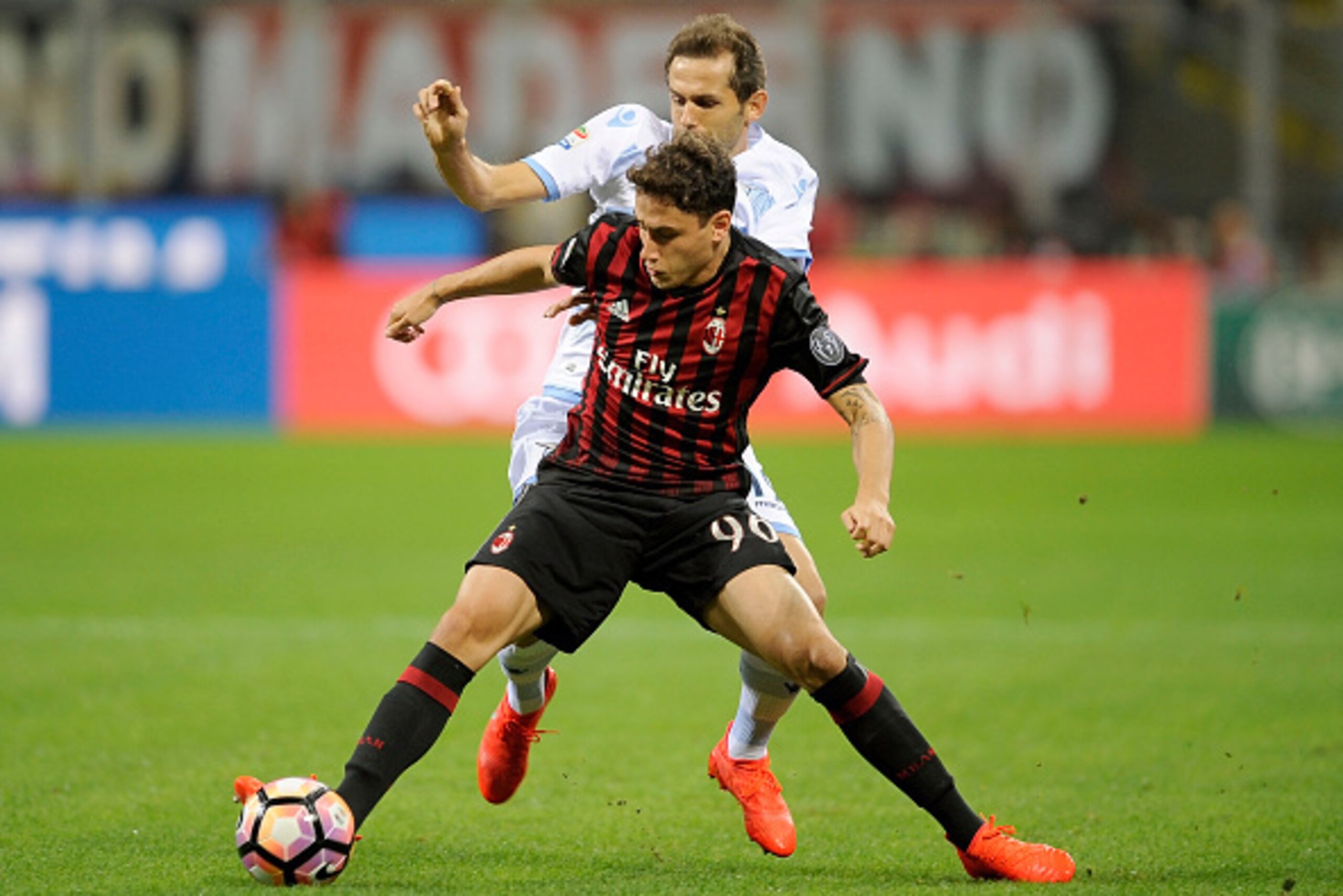 MILAN, ITALY - SEPTEMBER 20: Davide Calabria of AC Milan battles for the ball with Senad Lulic of SS Lazio during the Serie A match between AC Milan and SS Lazio at Stadio Giuseppe Meazza on September 20, 2016 in Milan, Italy. (Photo by Marco Rosi/Getty I MILAN, ITALY - SEPTEMBER 20: Davide Calabria of AC Milan battles for the ball with Senad Lulic of SS Lazio during the Serie A match between AC Milan and SS Lazio at Stadio Giuseppe Meazza on September 20, 2016 in Milan, Italy. (Photo by Marco Rosi/Getty I