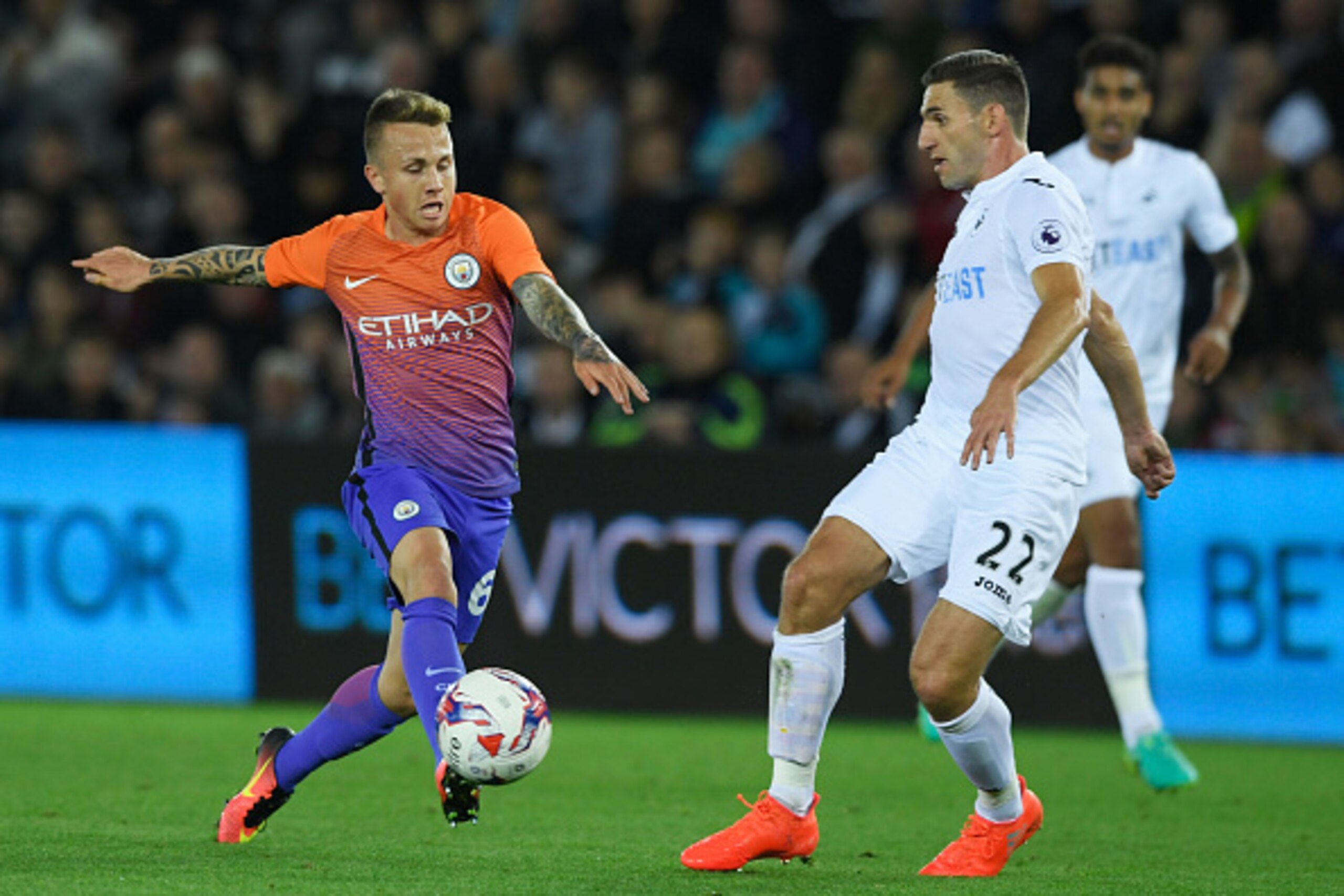 SWANSEA, WALES - SEPTEMBER 21: Jose Angel Esmoris Tasende of Manchester City and Angel Rangel of Swansea City in action  during the  EFL Cup Third Round match between Swansea City and Manchester City at the Liberty Stadium on September 21, 2016 in Swansea