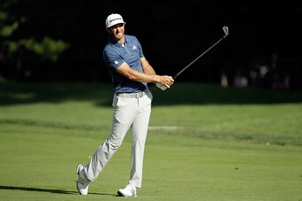 CARMEL, IN - SEPTEMBER 11:  Dustin Johnson hits his approach shot on the 15th hole during the final round of the BMW Championship at Crooked Stick Golf Club on September 11, 2016 in Carmel, Indiana.  (Photo by Andy Lyons/Getty Images)