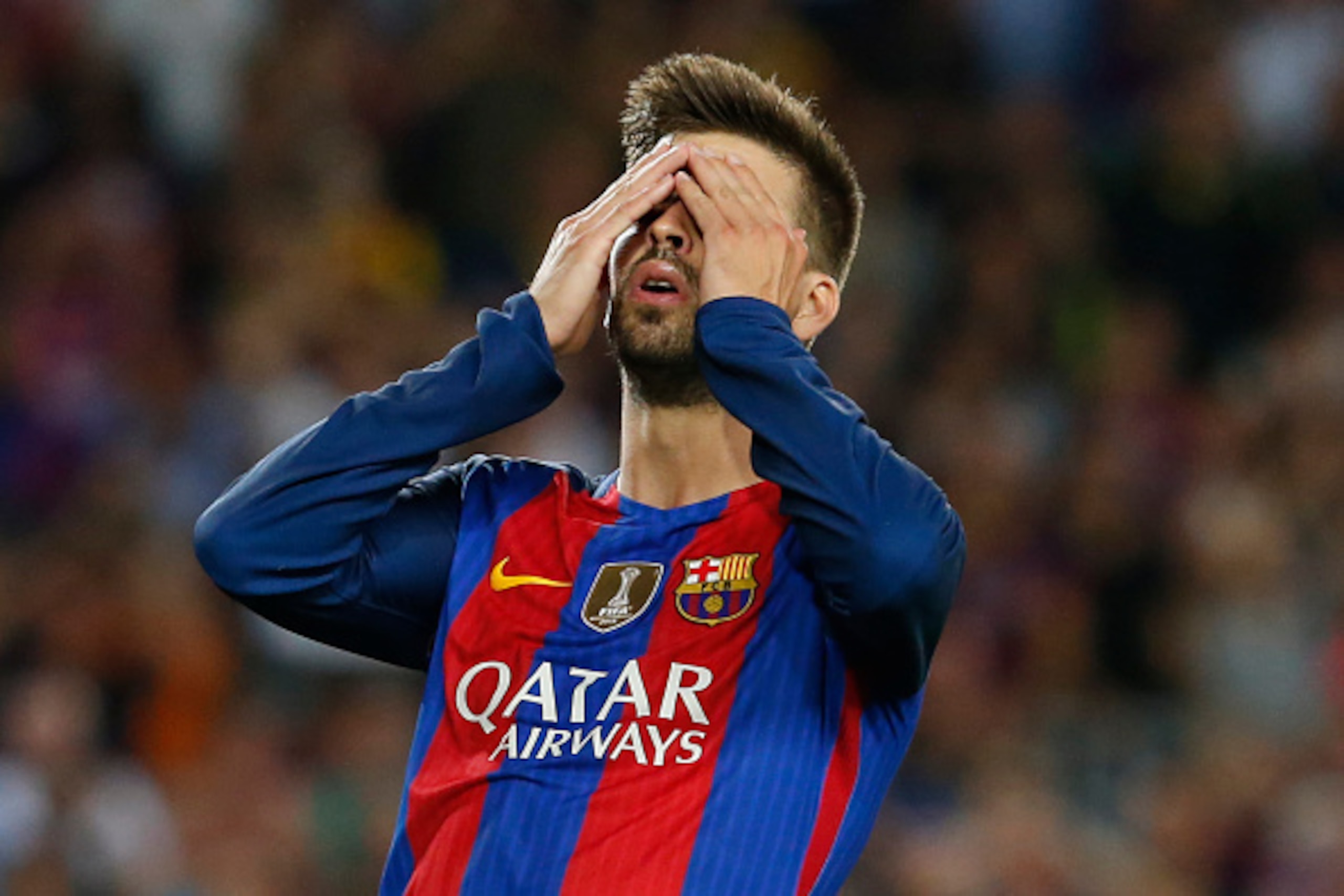 Barcelona's defender Gerard Pique gestures after missing a goal opportunity during the Spanish league football match FC Barcelona vs Atletico de Madrid at the Camp Nou stadium in Barcelona on September 21, 2016. / AFP / PAU BARRENA        (Photo credit sh