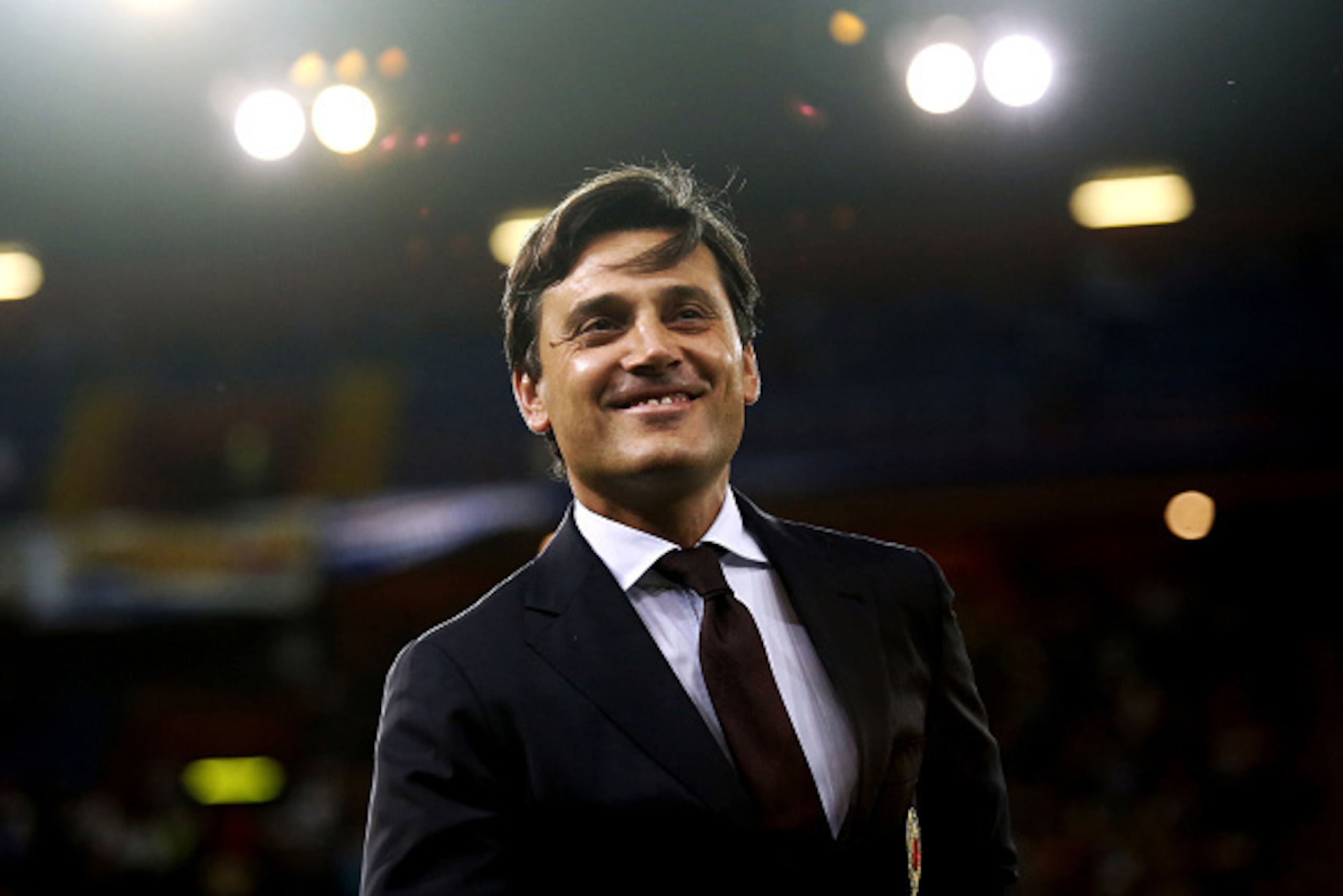 AC Milan's coach Vincenzo Montella smiles during the Italian Serie A football match between Sampdoria and AC Milan on September 16, 2016 at 'Luigi Ferraris Stadium' in Genoa. / AFP / MARCO BERTORELLO (Photo credit should read MARCO BERTORELLO/AFP/ AC Milan's coach Vincenzo Montella smiles during the Italian Serie A football match between Sampdoria and AC Milan on September 16, 2016 at 'Luigi Ferraris Stadium' in Genoa. / AFP / MARCO BERTORELLO (Photo credit should read MARCO BERTORELLO/AFP/