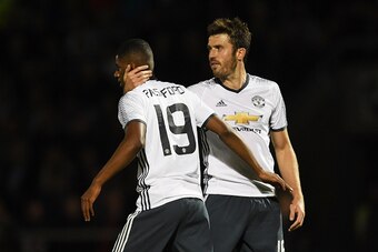 NORTHAMPTON, ENGLAND - SEPTEMBER 21: Marcus Rashford of Manchester United celebrates scoring his sides third goal with Michael Carrick of Manchester United during the  EFL Cup Third Round match between Northampton Town and Manchester United at Sixfields o
