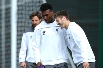 LIVERPOOL, ENGLAND - SEPTEMBER 30:  Daniel Sturridge shares a joke with Adam Lallana during a Liverpool FC training session at Melwood Training Ground on September 30, 2015 in Liverpool, England.  (Photo by Jan Kruger/Getty Images)