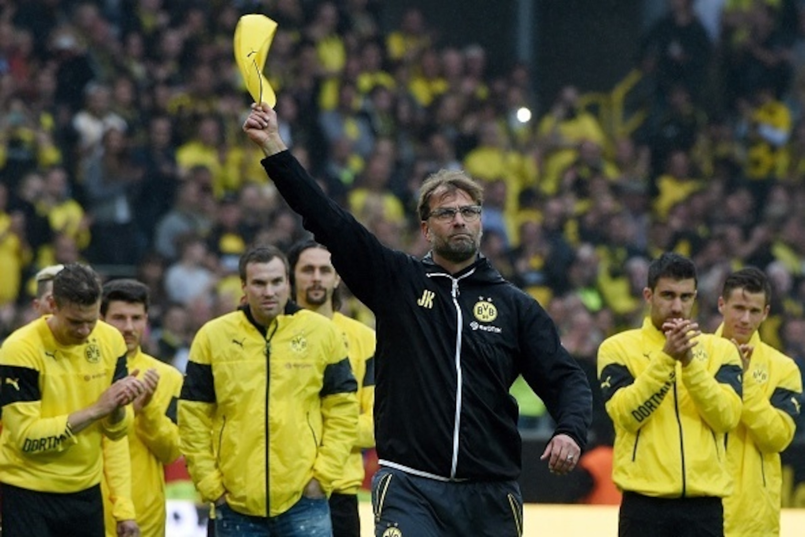 Dortmund's head coach Juergen Klopp and Dortmund's players celebrate after the German first division Bundesliga football match between Borussia Dortmund and SV Werder Bremen at the Signal Iduna Park in Dortmund, western Germany on May 23, 2015. Dortmund w