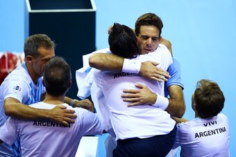 GLASGOW, SCOTLAND - SEPTEMBER 16:  Juan Martin del Potro of Argentina celebrates victory with his team after his singles match against Andy Murray of Great Britain during day one of the Davis Cup Semi Final between Great Britain and Argentina at Emirates 